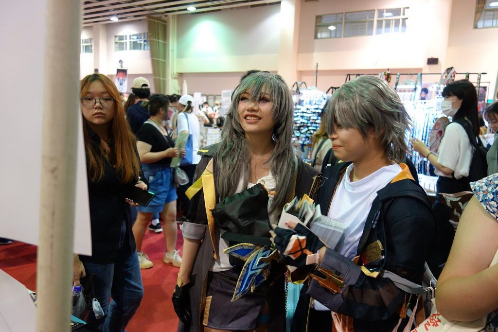 Honkai: Star Rail cosplayers dressed as Trailblazers at a doujinshi fair in Taiwan