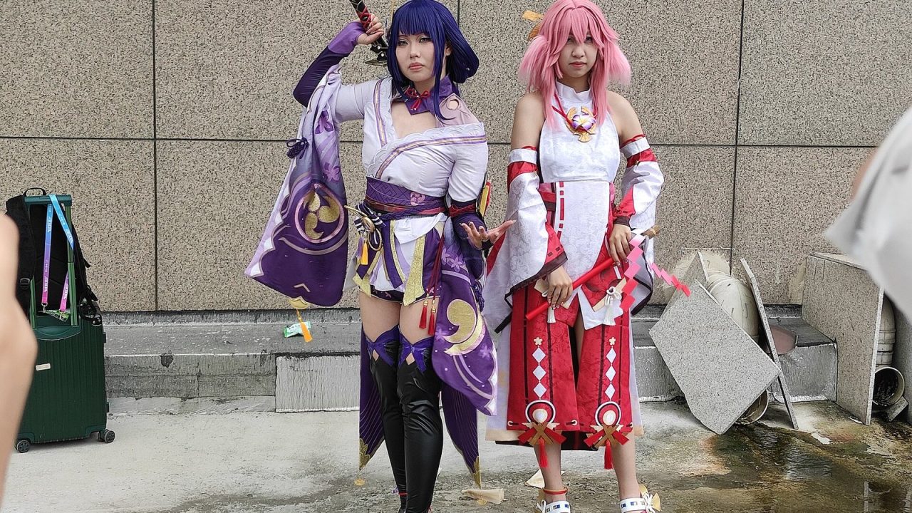 Cosplayers dressed as Genshin Impact's Raiden Shogun and Yae Miko at the 19th CICAF