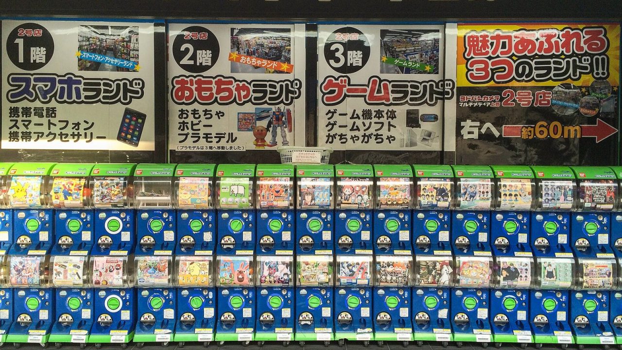 Rows of Bandai gashapon capsule toy machines in an electronics store in Ueno, Tokyo